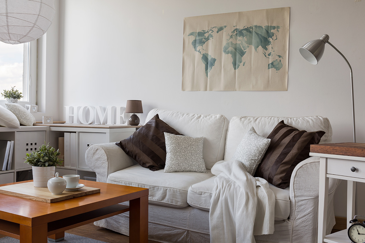 Comfortable-white-double-sofa at The Highlands Apartments offers one, two, and three-bedroom apartment homes for rent in Charlotte, NC